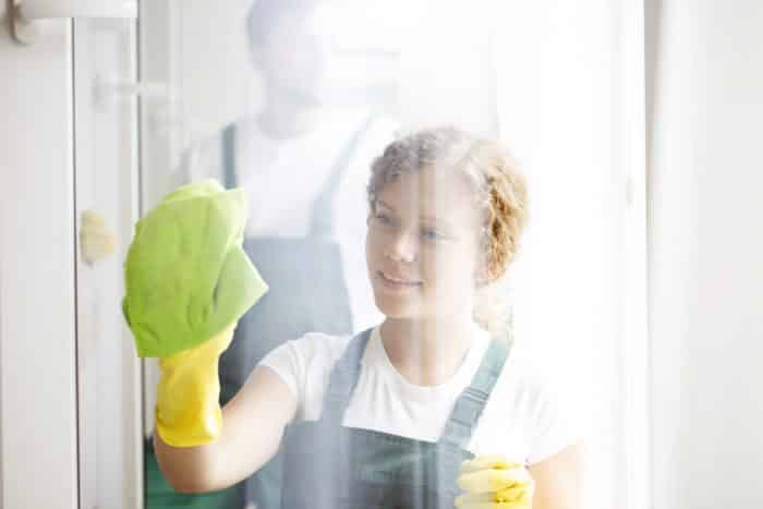 Woman Cleaning Window